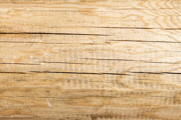 Obraz premium Natural hewn pine log with cracks, close-up , background photo