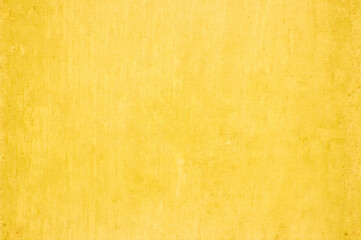 Yellow concrete stone texture for background in summer wallpaper. Cement and sand wall of tone vintage minimal. Concrete abstract wall of light orange color, cement texture white blank for home decor.