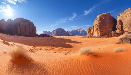 Naklejka premium A vast desert with towering sandstone formations, under a clear blue sky and intense midday sun