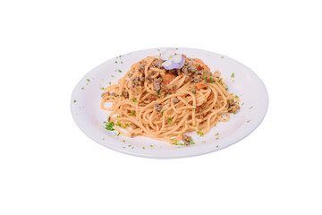 A plate of spaghetti with a classic meat sauce, topped with a small flower and chopped parsley.