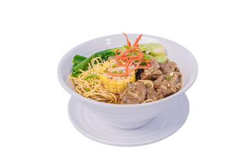 A bowl of noodle soup with beef, corn, and vegetables in a rich, savory broth.
