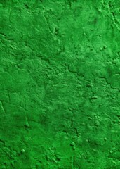 Fototapeta premium The wall has a bright green texture with an artistic rough surface.