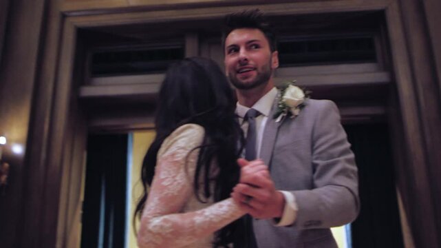 Couple shares their first dance together at a romantic wedding