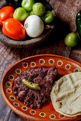 Dish full of moronga or blood sausage, with tortillas, a typical food from Mexico, Central America...