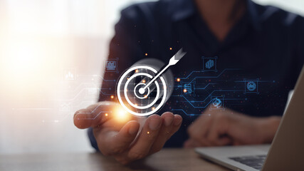 Businessman with icons, business investment goals and goals, marketing strategies and goals for success.