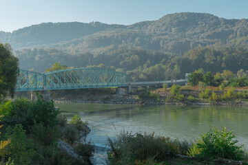 Fototapeta premium Steel girder bridge leading from Brezice south over Sava and Krka river. Early morning hazy feeling