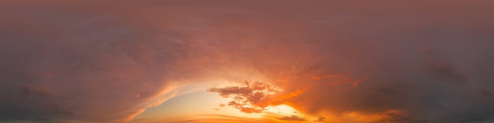 Golden glowing red orange overcast sunset sky 360 hdr panorama. Seamless spherical equirectangular panorama. Sky dome or zenith for 3D visualization and sky replacement for aerial drone 360 panoramas
