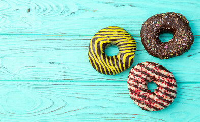 Sweet glazed colorful donuts . Top view