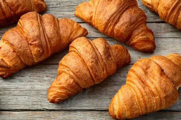 Group of sweet croissant . French morning breakfast . Top view