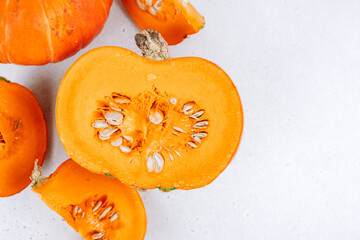 Cut pumpkin on the table. Close-up.