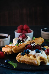 still life Belgian waffles on dark background