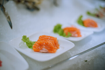 selective focus. Japanese sushi food. Sushi set plate served with ginger and soy sauce. Sushi rolls, salmon nigiri, shrimp nigiri, tuna nigiri