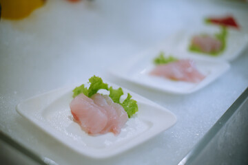 selective focus. Japanese sushi food. Sushi set plate served with ginger and soy sauce. Sushi rolls, salmon nigiri, shrimp nigiri, tuna nigiri