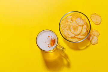 A vibrant photo showcasing a glass of beer and potato chips