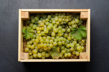 A wicker basket brimming with grapes