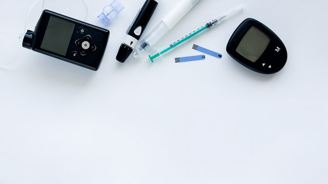 Medical devices and tools for diabetes management on white background - Powered by Adobe
