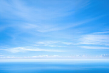 Blue sky with clouds ocean on horizon line