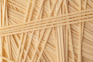 Flat wheat noodles background. Abstract wallpaper, texture.