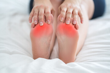 Female foot closeup, corns and calluses on feet, dry skin on legs, cracked heels, barefoot woman...