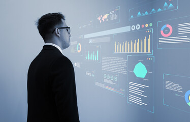 Businessman watch virtual KPI dashboard. Financial business KPI System data analytics graph dashboard.Data System KPI and metrics connected in database for follow earnings,operations and sales data. 