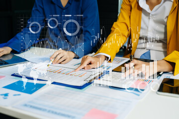 Team colleagues wear formal attire to work together to optimize business processes by using new technologies.