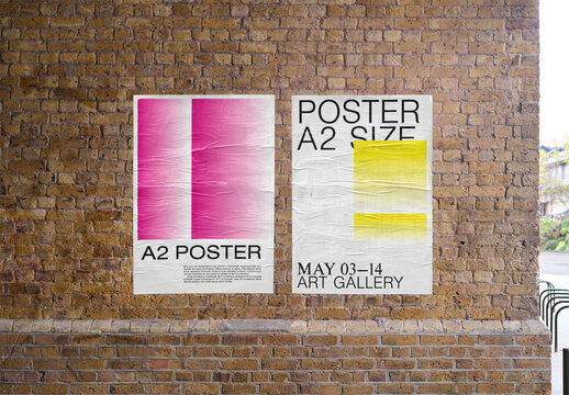 Mockup Of Two Customizable Vertical Posters On Building