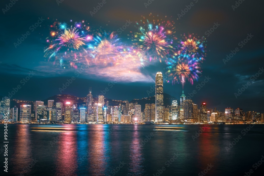 Poster A vibrant fireworks display explodes over a Hong Kong cityscape at night, illuminating the water with colorful reflections.