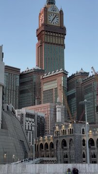 Makkah, Kingdom of Saudi Arabia - 29.01.2024: Overview of the Clock Towers. Camera movement from top to bottom of the building.
