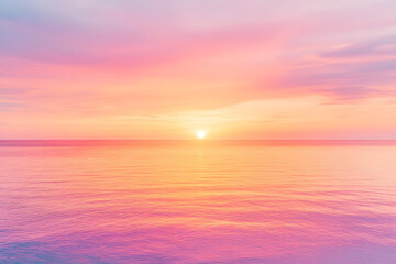 Fototapeta premium The fiery sun dips below the ocean's horizon, painting the sky with vibrant hues of orange and purple