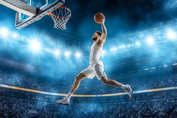 Fotobehang A basketball player jumping, mid-air, and about to dunk © MohdAdzmer