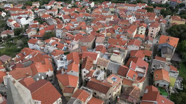 Video footage of Croatia, island Krk, Vrbnik. Aerial view of the roofs of houses, the Gothic Chapel of the Rosary, the Chapel of St. John in the Parish Church of the Assumption 