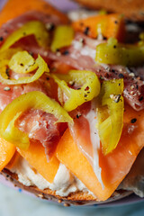 cantaloupe, peperoncini, prosciutto, cream cheese on everything bagel