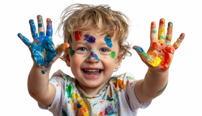 A young child is holding up his hands and smiling