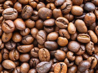 Close-up top view of scattered coffee beans
