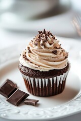 Chocolate cupcake on a white plate