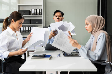 Businessman team working are under stress from financial data and report graph.