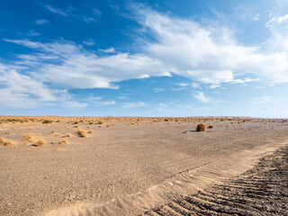 Gobi desert sand ground and sky clouds natural landscape. car advertising background.
