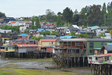 several colorful houses in a fishing village in Chiloe in Chile