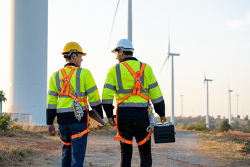 Diverse ethnicity male technicians working in the wind turbines field. 