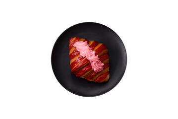 Fototapeta premium Crispy fresh red croissant with cream and strawberries