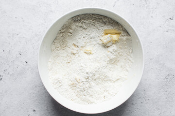 flatlay of ingredients for making nigerian egg roll in a white bowl, process of making egg rolls