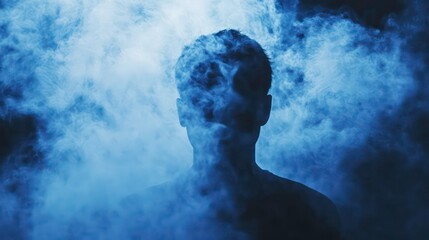 A silhouette of a man standing in a haze of purple smoke.