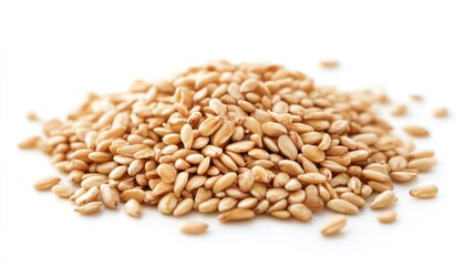 Close-up of a pile of raw hulled barley grains isolated on a white background.