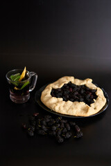 A galette pie with mulberry and  cold homemade mojito, soda with the mulberry