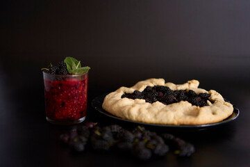 A galette pie with mulberry and  multivitamin smoothie with a mulberry, raspberry, gooseberry, currant, mint, orange, gooseberry