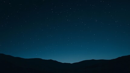 Starry night sky with a gradient of deep blue hues and sparkling stars, creating a mesmerizing scene that evokes feelings of wonder and mystery