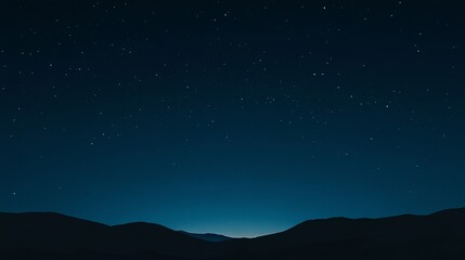 Starry night sky with a gradient of deep blue hues and sparkling stars, creating a mesmerizing scene that evokes feelings of wonder and mystery