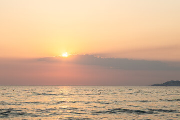 Sunset at beach over the Adriatic sea near the city of Dürres in Albania, which is a port city in western Albania, west of the capital, Tirana and known for its huge Roman amphitheatre