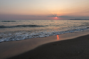 Sunset at beach over the Adriatic sea near the city of Dürres in Albania, which is a port city in western Albania, west of the capital, Tirana and known for its huge Roman amphitheatre