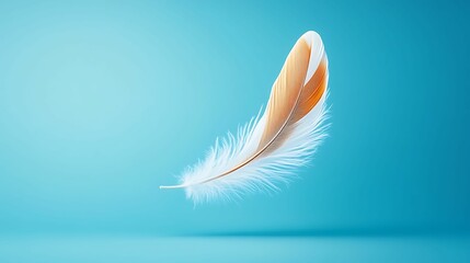 Fototapeta premium A delicate, floating feather with a warm gradient against a calming blue background, symbolizing lightness and grace.